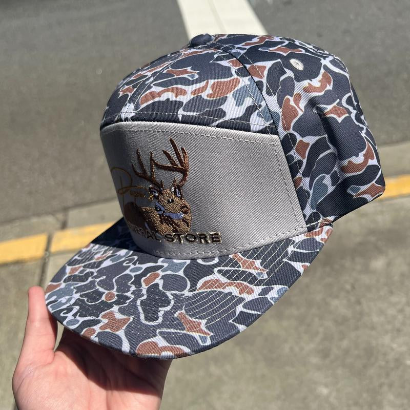 The Bedded Buck Black Old School Camo 7 Panel PGS Trucker Hat